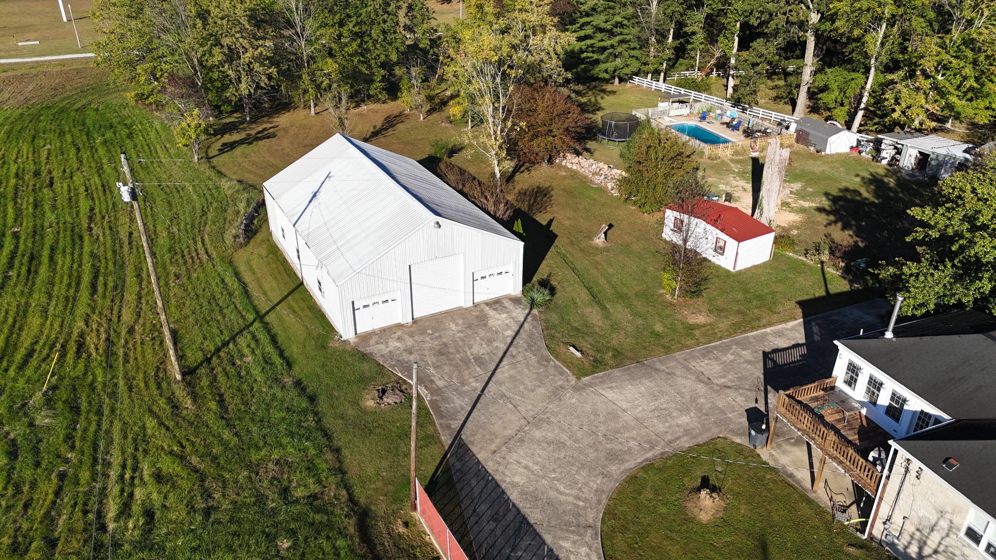 304 Church Street Lafayette, TN 37083 - Photo 7 of 9 an aerial view of a house with a yard and trees