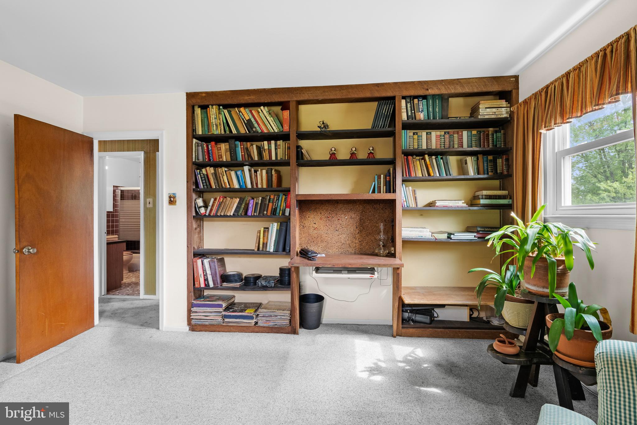 2235 South County Line Road Telford, PA 18969 - Photo 18 of 63 a living room with furniture and a book shelf