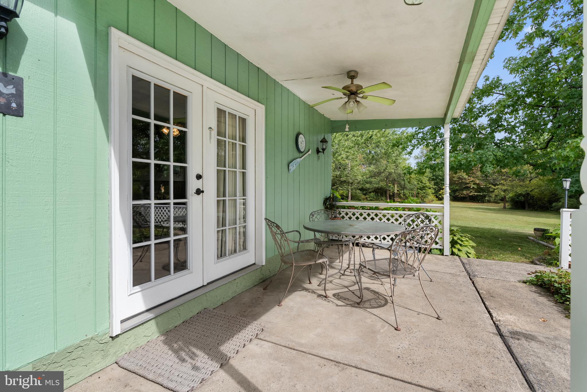 2235 South County Line Road Telford, PA 18969 - Photo 29 of 63 a view of a patio with a table and chairs