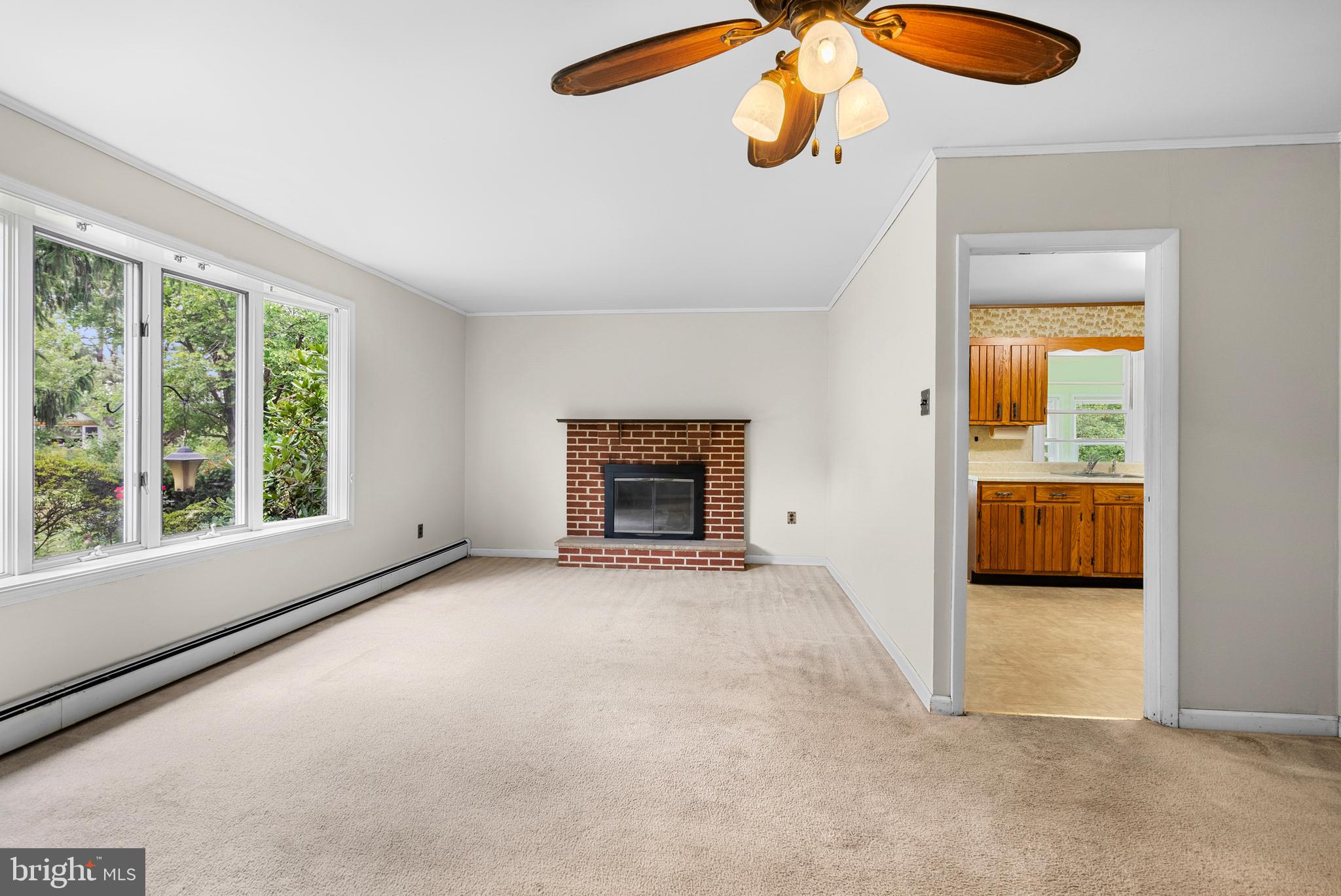 2235 South County Line Road Telford, PA 18969 - Photo 38 of 63 a view of an empty room with a fireplace and a window