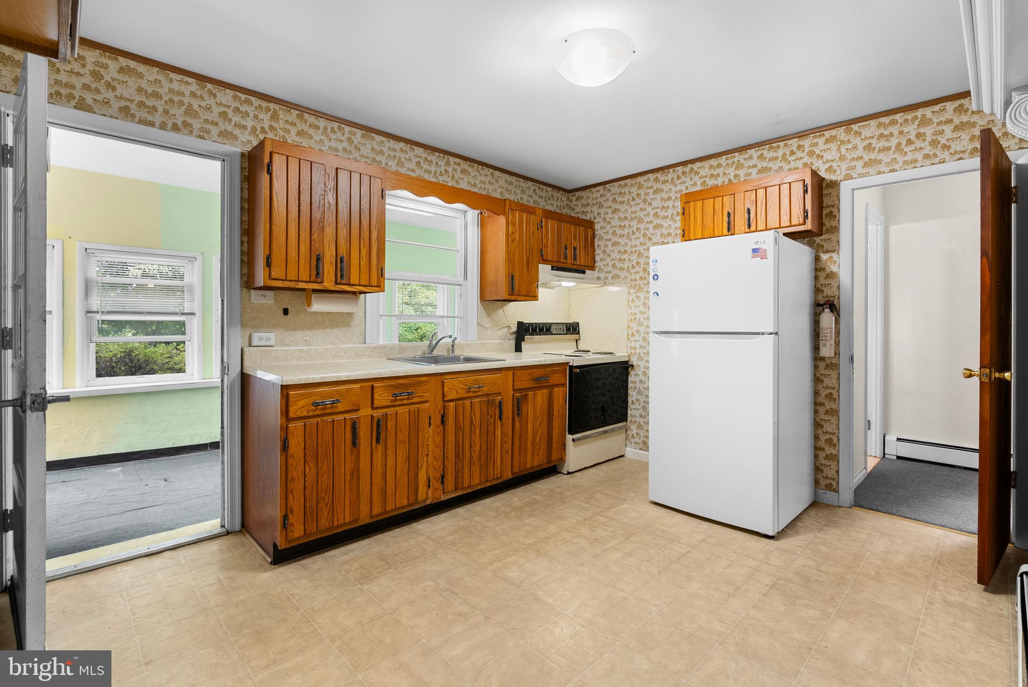 2235 South County Line Road Telford, PA 18969 - Photo 39 of 63 a utility room with refrigerator a washer and a window
