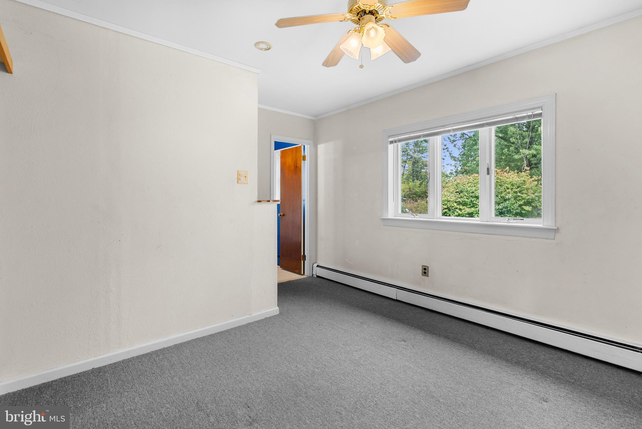2235 South County Line Road Telford, PA 18969 - Photo 41 of 63 an empty room with a window and a chandelier fan
