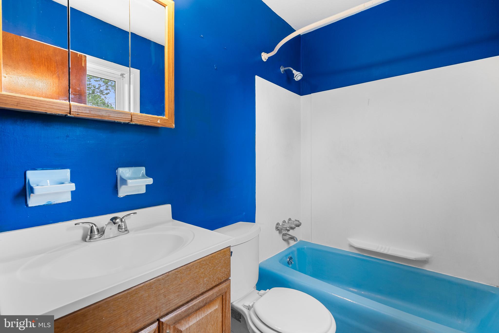 2235 South County Line Road Telford, PA 18969 - Photo 44 of 63 a bathroom with a sink a toilet and mirror