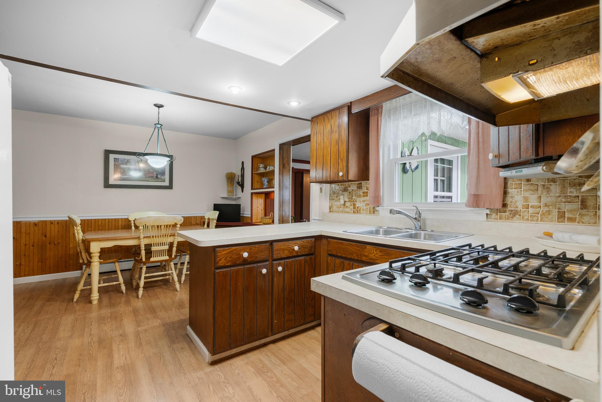 2235 South County Line Road Telford, PA 18969 - Photo 10 of 63 a kitchen with a stove and a dining table