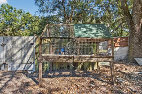 a view of outdoor space with garden and trees