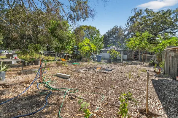 a view of yard with green space and seating area