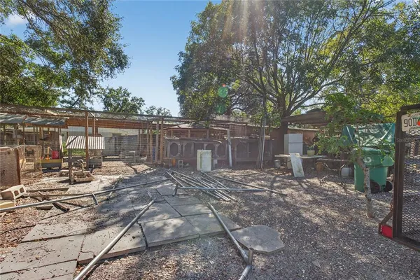 an outdoor space with furniture and garden