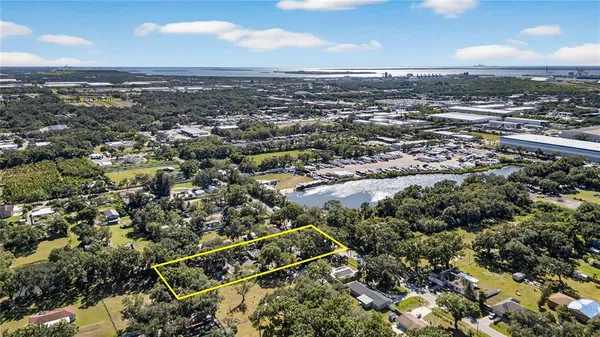 a backyard of a house with plants and outdoor seating