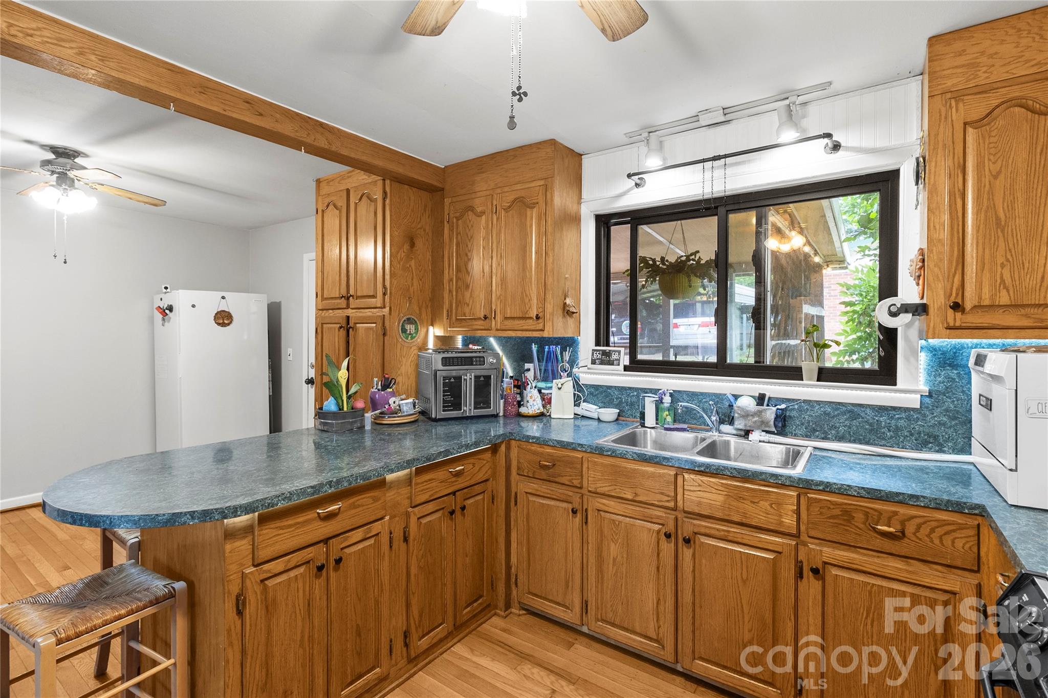325 Swanson Road Lenoir, NC 28645 - Photo 11 of 35 a kitchen with stainless steel appliances granite countertop a sink and a counter space