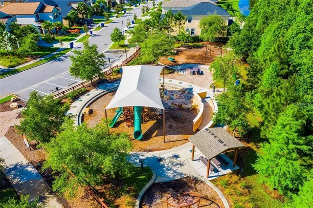 an aerial view of a house with yard swimming pool and outdoor seating