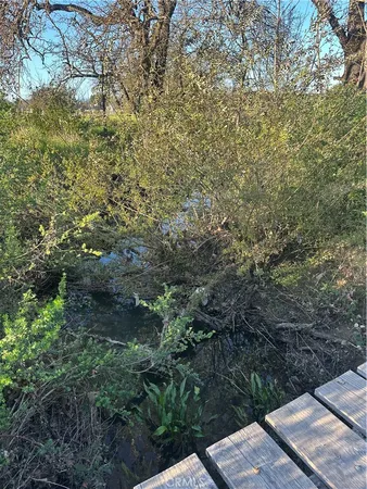 a view of a lake with a yard