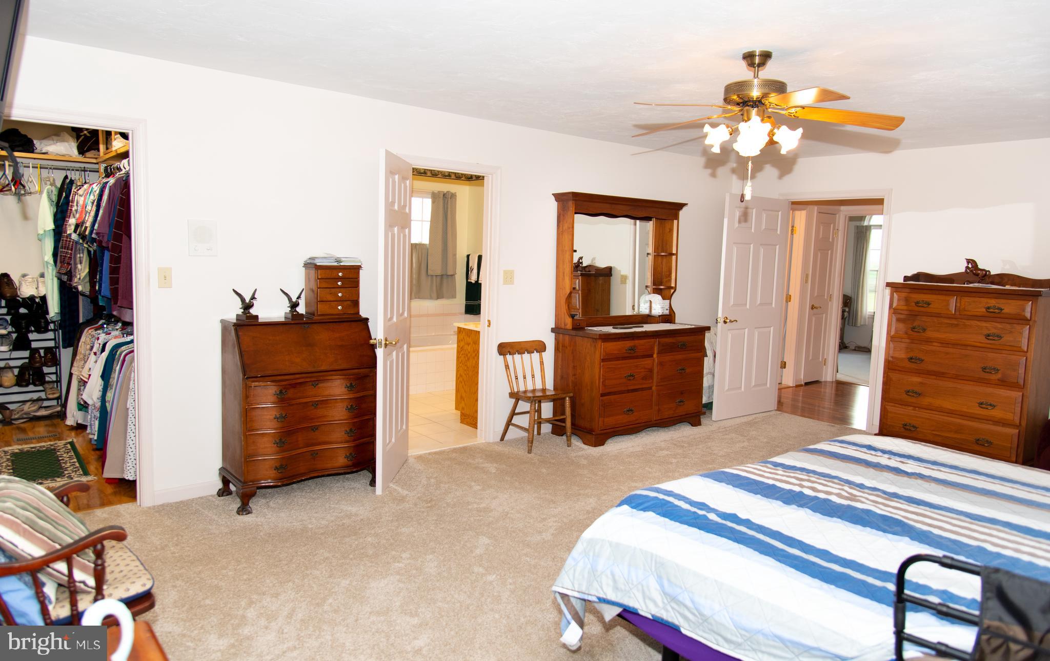 2165 Harney Road Littlestown, PA 17340 - Photo 22 of 54 Primary Bedroom walk-in closet and Bath/Laundry