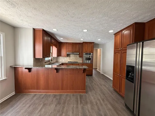 $600,000 | 5062 Bridgeport Lane Northwest, Peachtree Corners, GA 30092