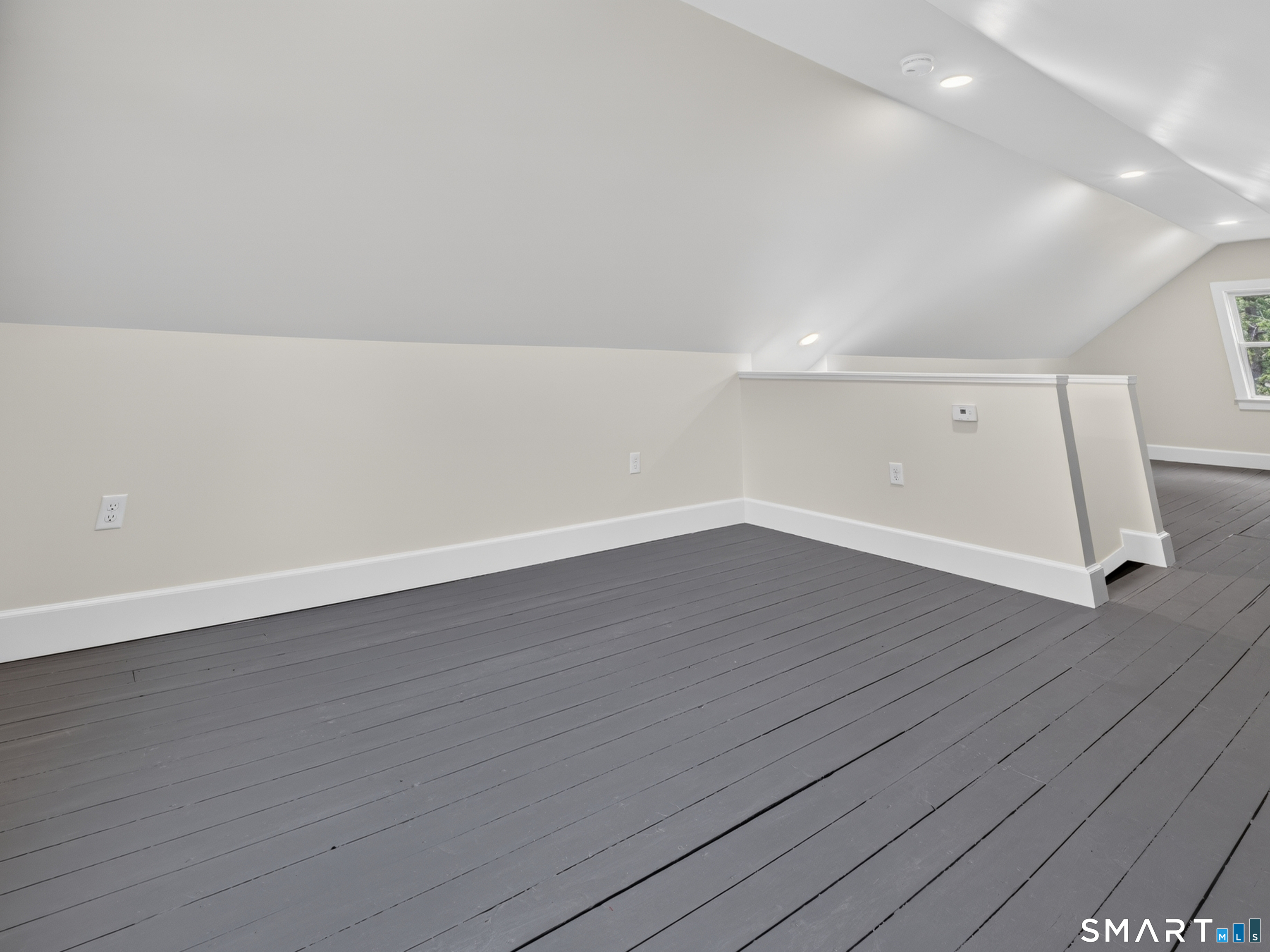 1039 N Road Groton, CT 06340 - Photo 16 of 26 a view of an empty room with wooden floor