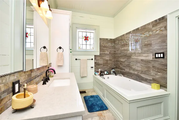 a bathroom with a sink a bathtub and a shower