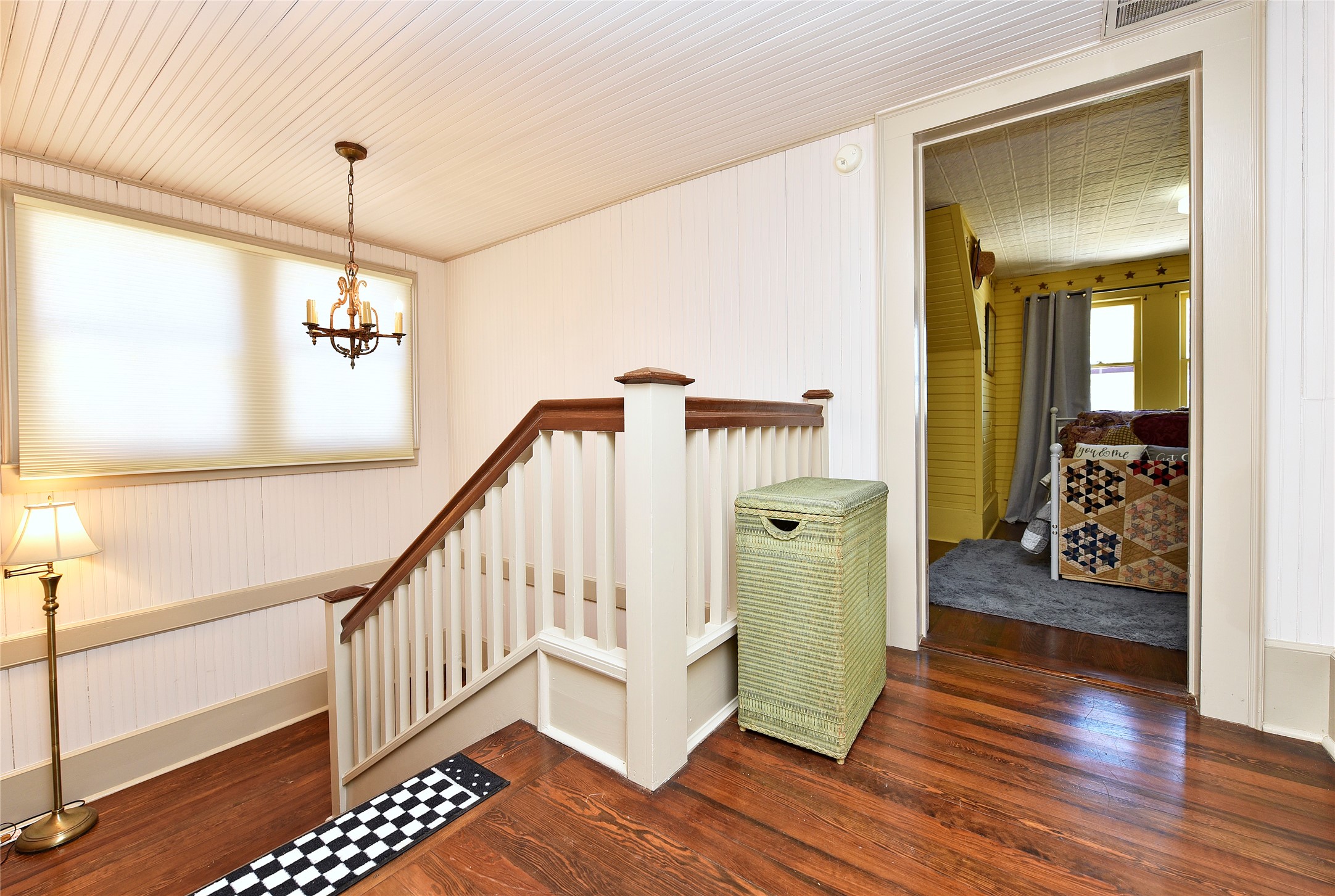 315 Cedar Street New Ulm, TX 78950 - Photo 19 of 50 a hallway with wooden floor and stairs