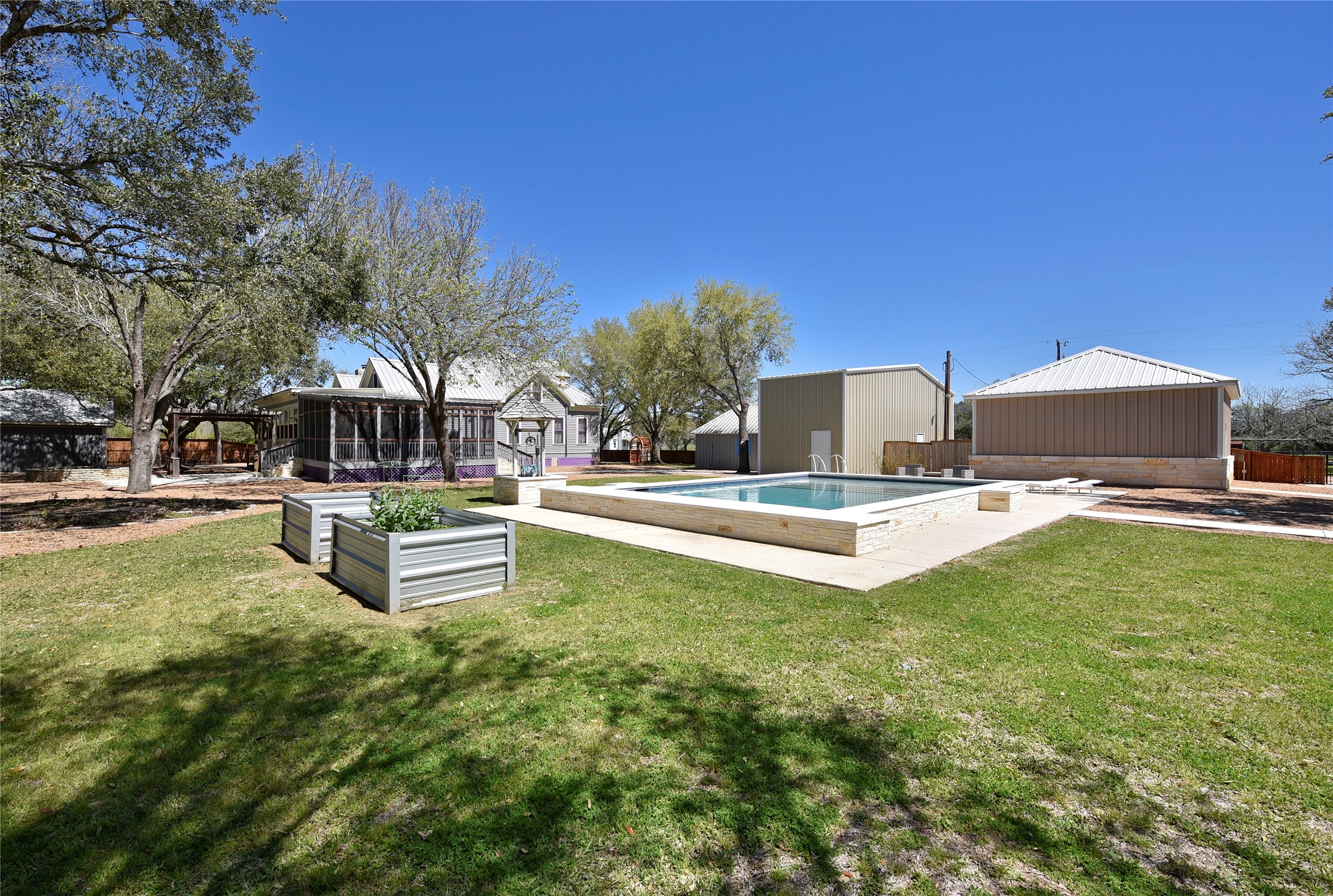315 Cedar Street New Ulm, TX 78950 - Photo 24 of 50 a view of a fountain with a big yard