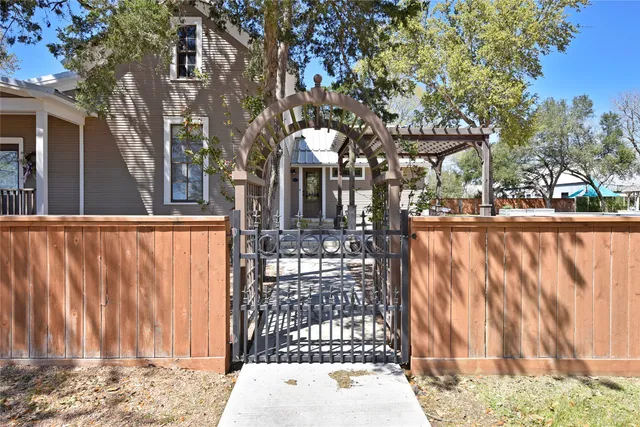 an aerial view of residential houses with outdoor space and swimming pool