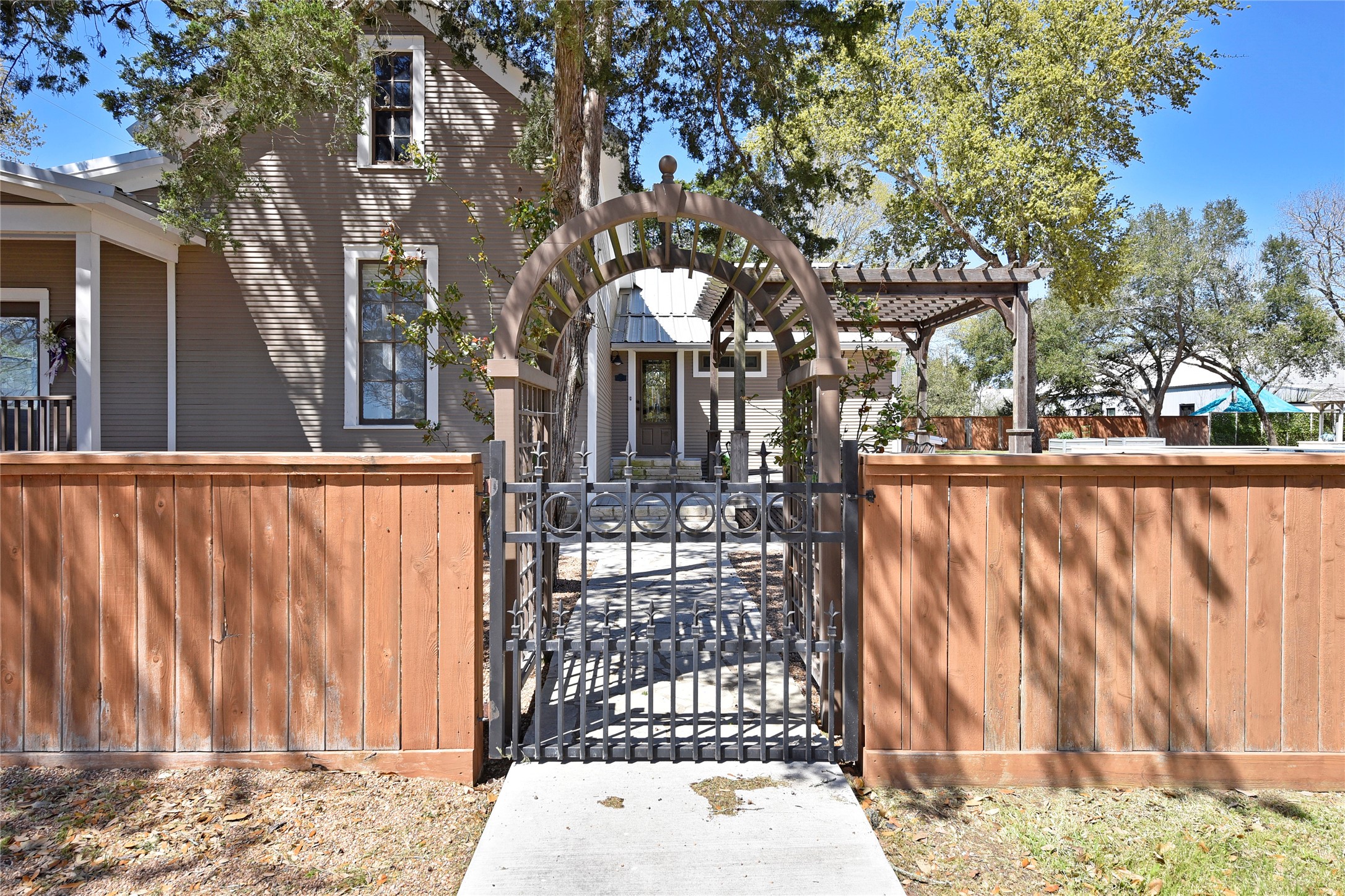 315 Cedar Street New Ulm, TX 78950 - Photo 28 of 50 a view of a brick house with a large tree