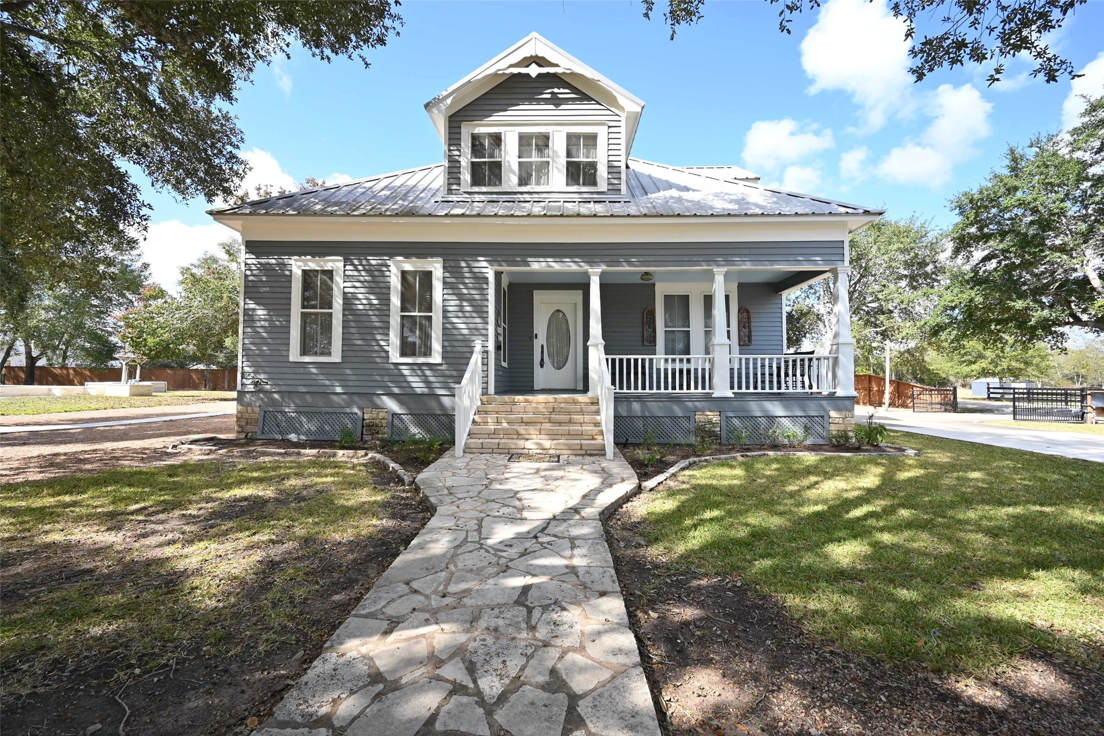 315 Cedar Street New Ulm, TX 78950 - Photo 3 of 50 a front view of a house with a yard