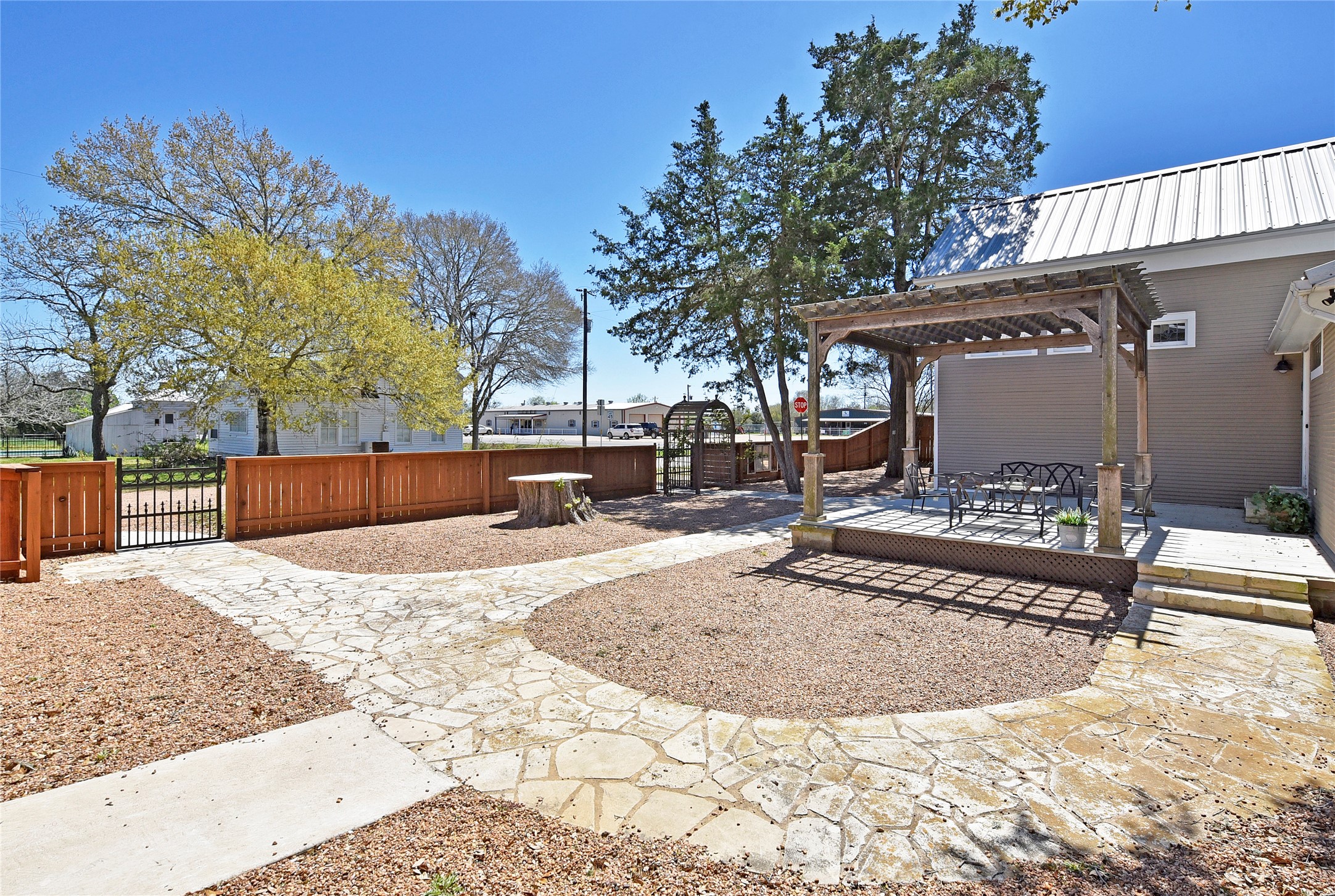 315 Cedar Street New Ulm, TX 78950 - Photo 31 of 50 a view of a backyard with snow on the road