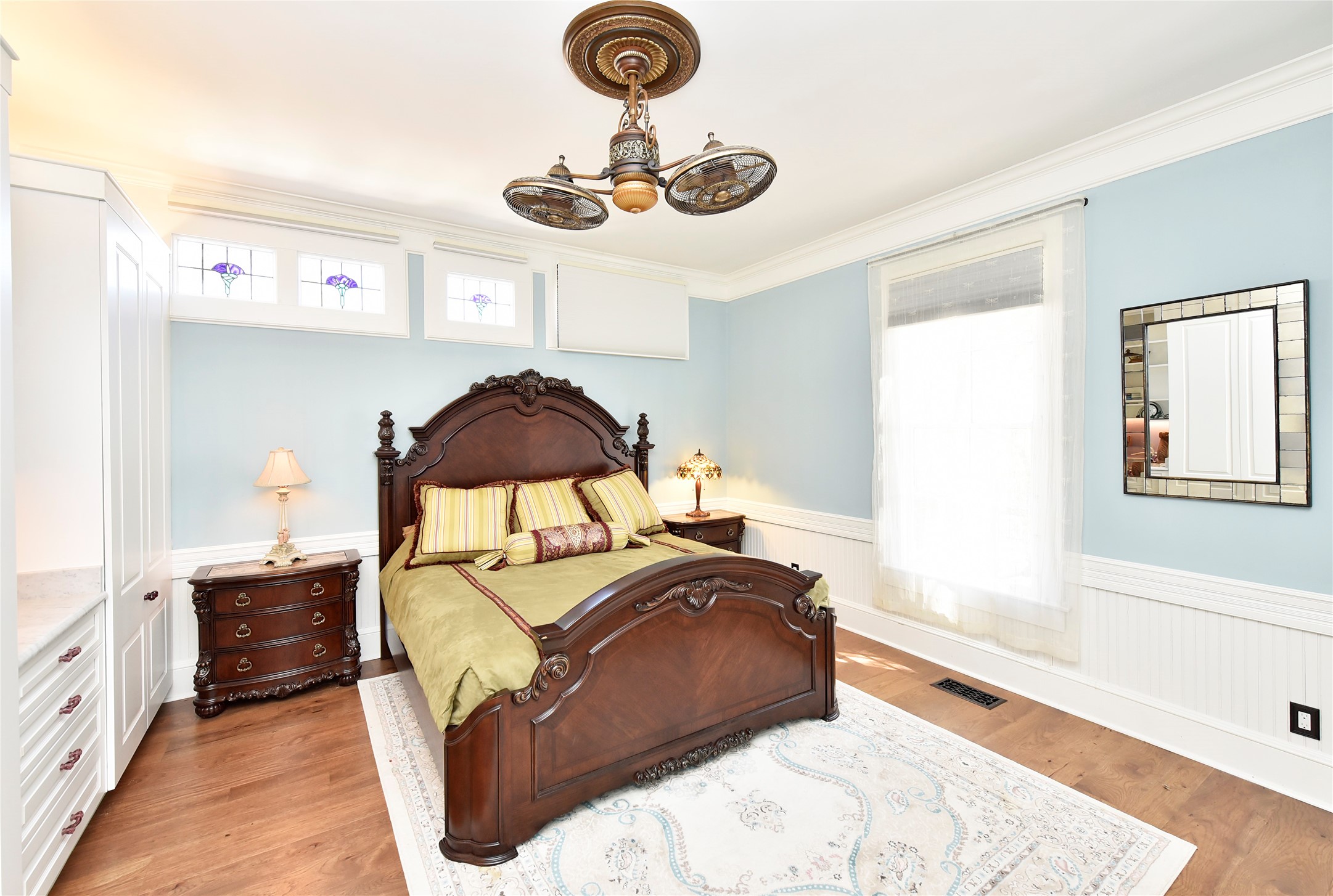 315 Cedar Street New Ulm, TX 78950 - Photo 37 of 50 a bedroom with a bed and a chandelier