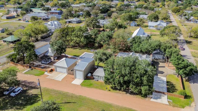 an aerial view of residential house with outdoor space and swimming pool