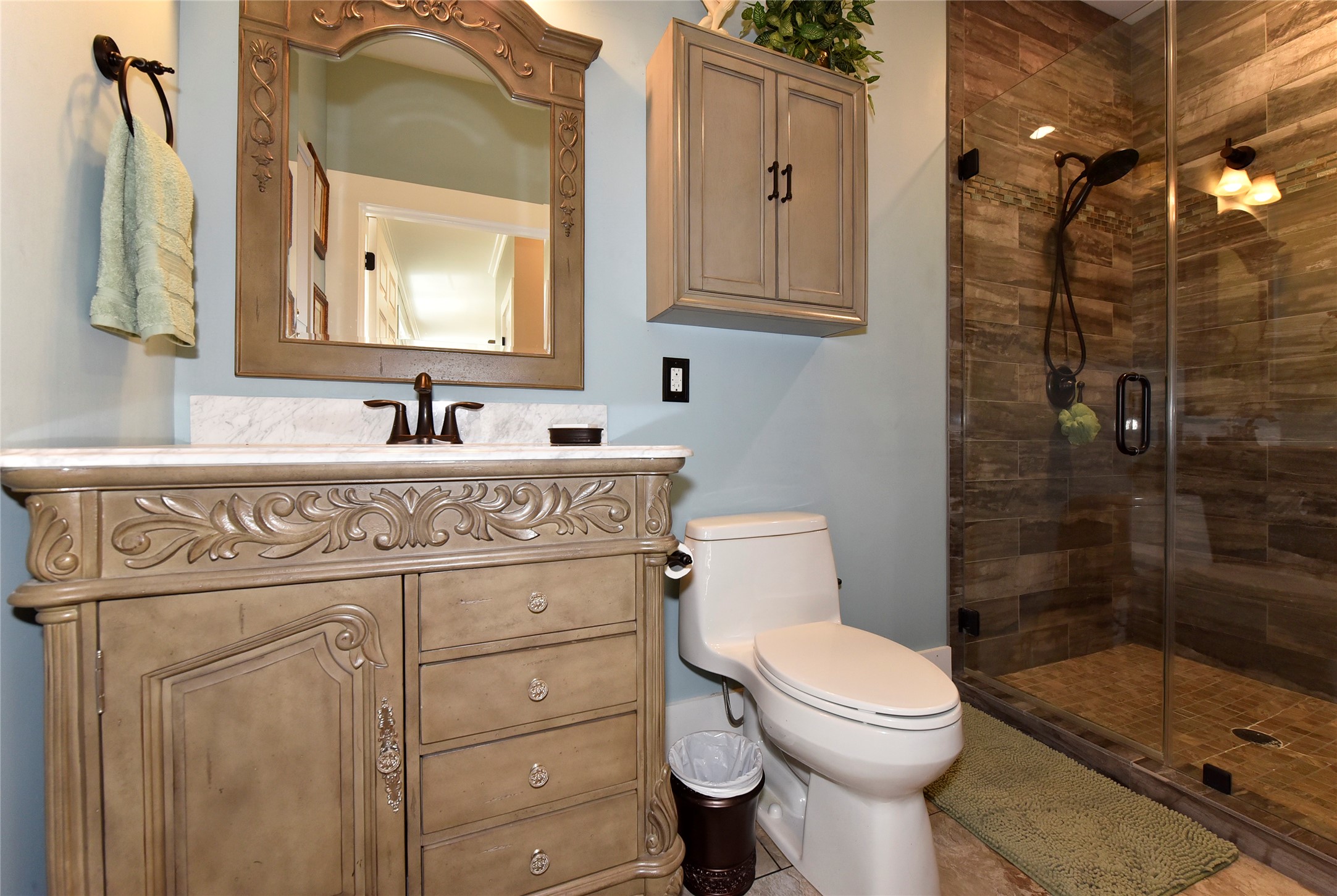 315 Cedar Street New Ulm, TX 78950 - Photo 41 of 50 a bathroom with a toilet sink vanity and mirror