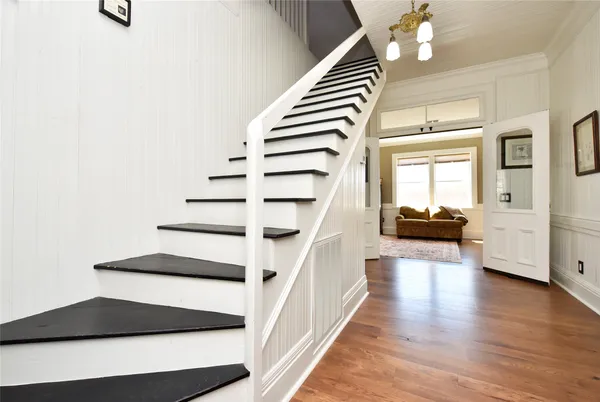 a view of a room with wooden floor