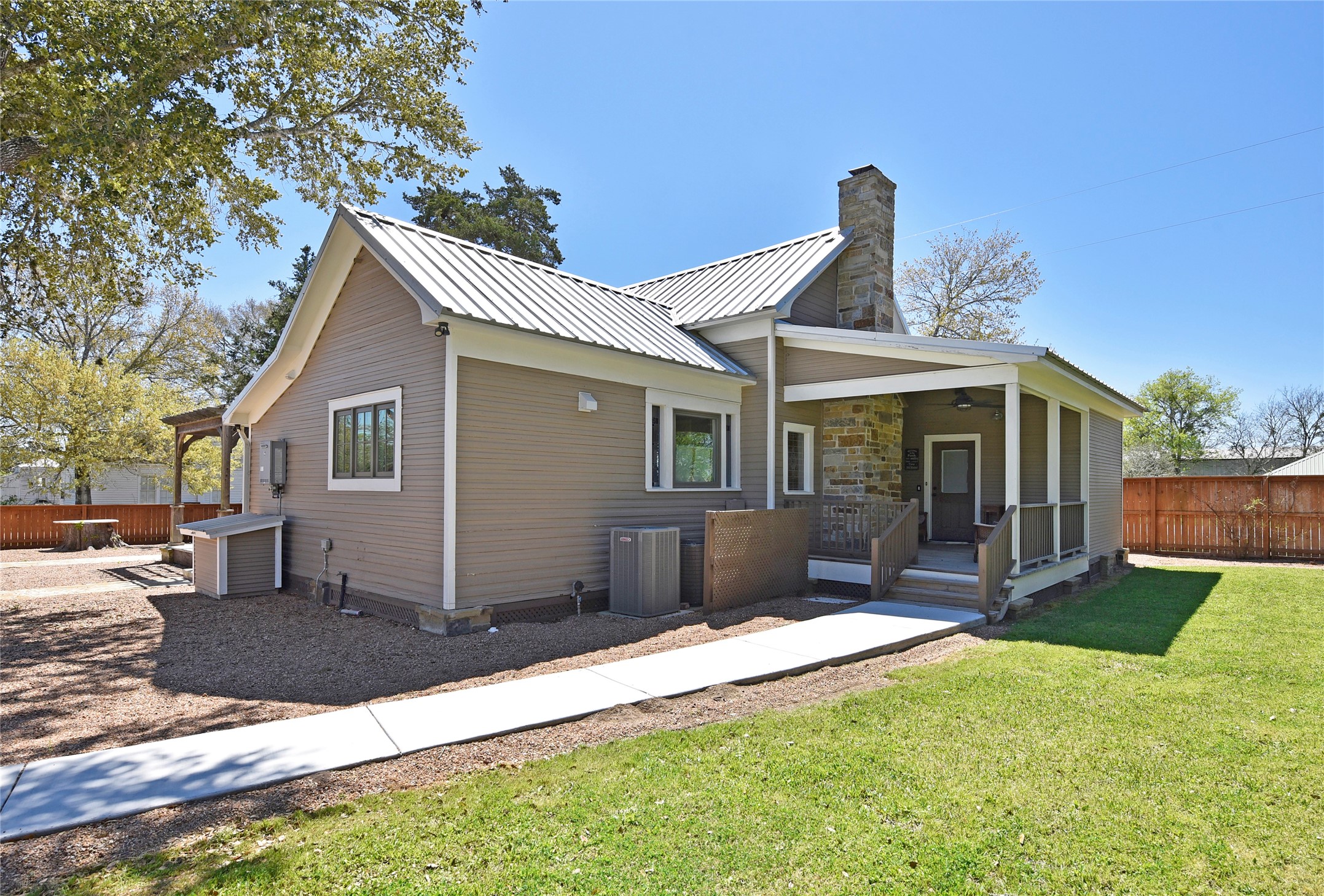 315 Cedar Street New Ulm, TX 78950 - Photo 45 of 50 a view of a house with a yard