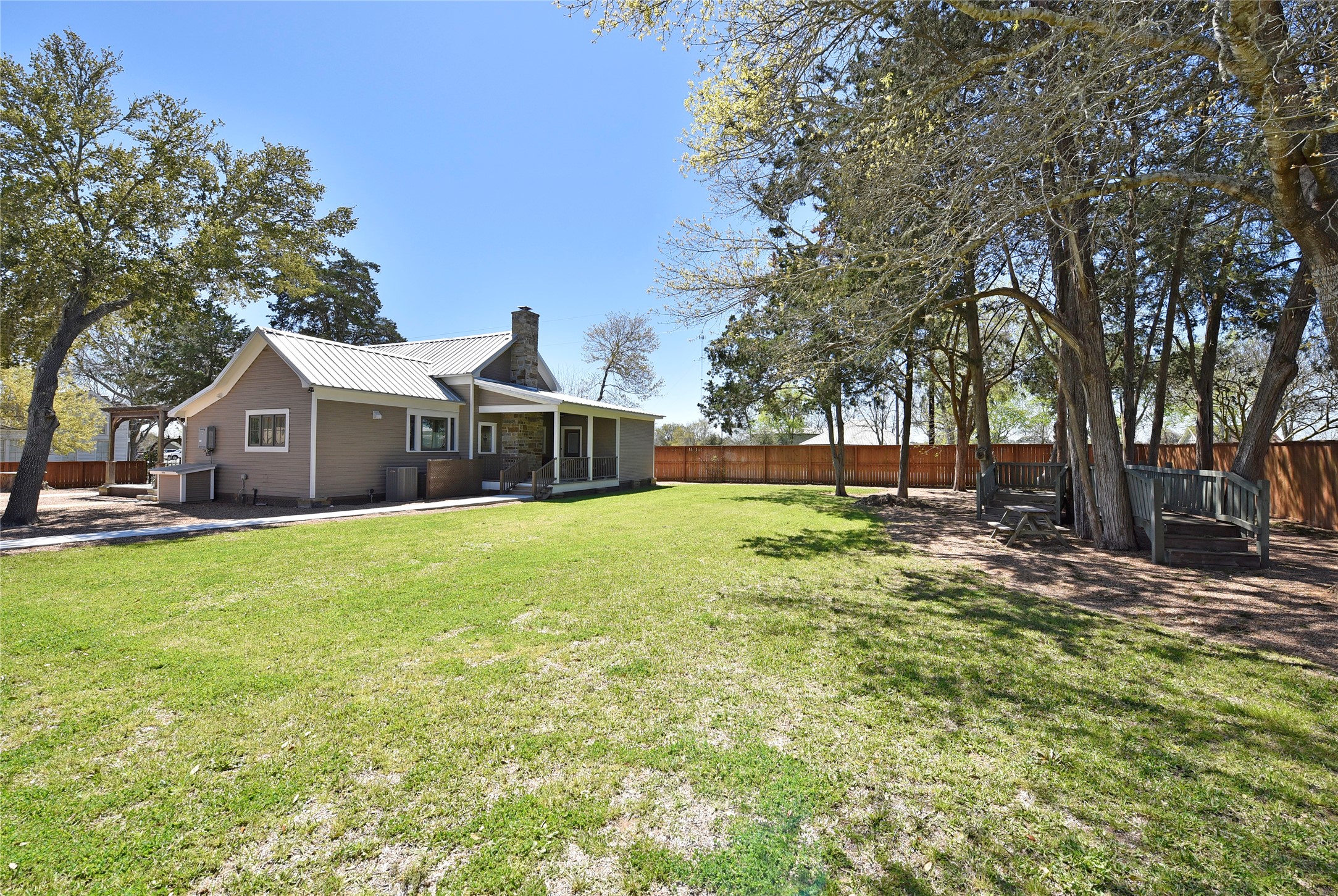 315 Cedar Street New Ulm, TX 78950 - Photo 47 of 50 a view of house with garden and trees