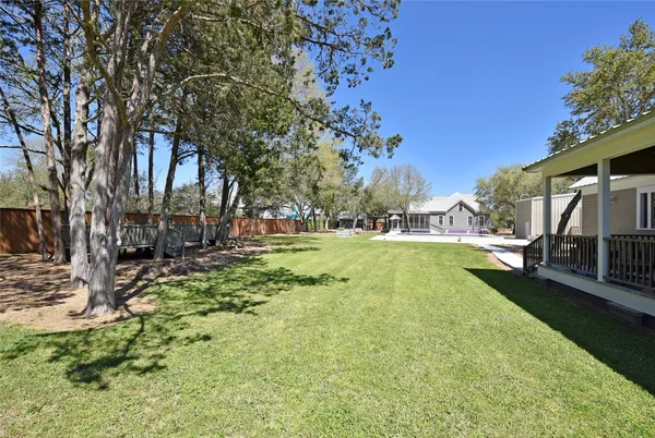 a view of a house with a backyard