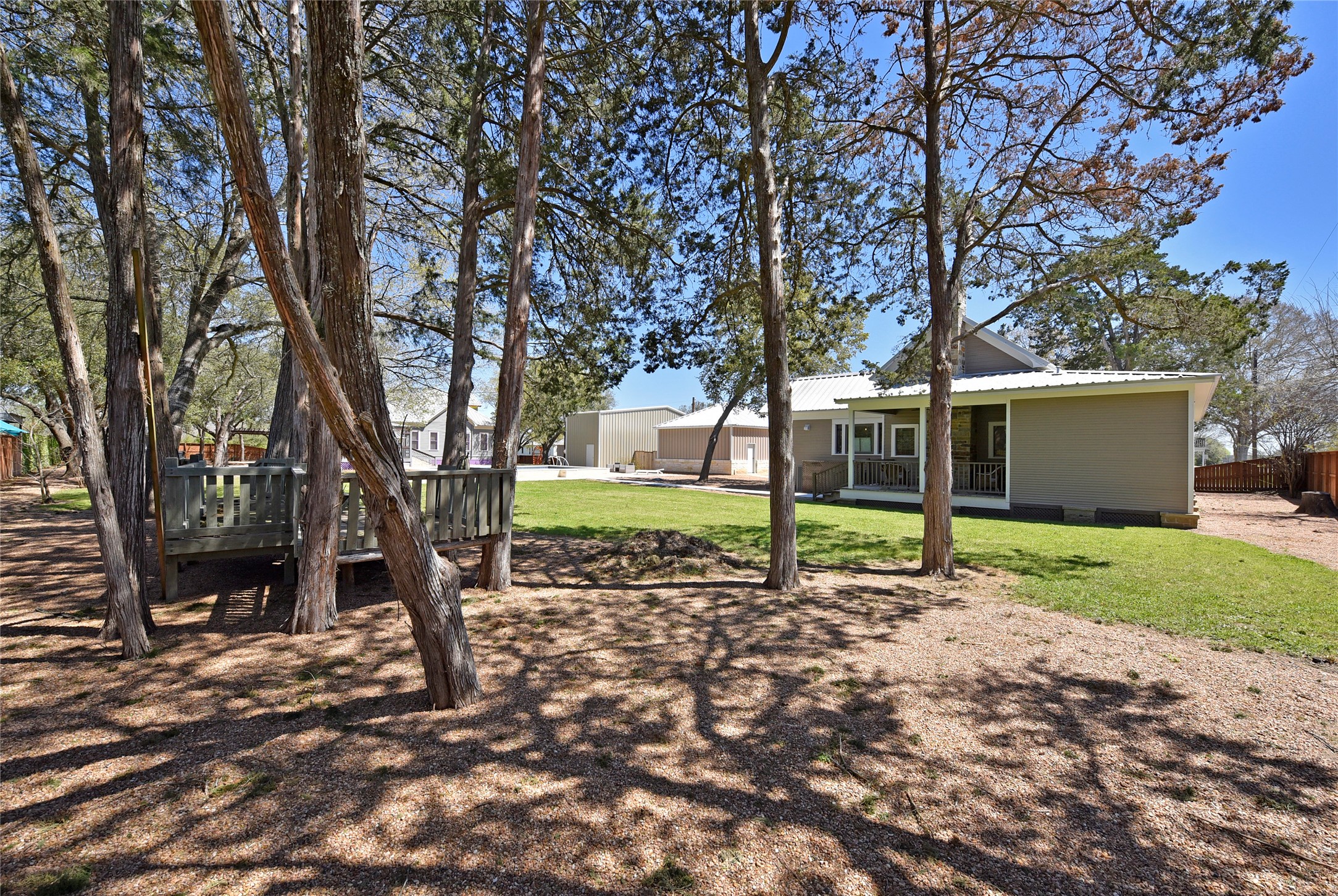 315 Cedar Street New Ulm, TX 78950 - Photo 49 of 50 a view of a house with a backyard