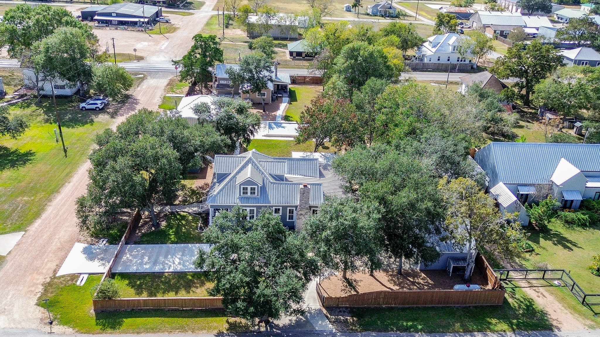 315 Cedar Street New Ulm, TX 78950 - Photo 50 of 50 an aerial view of residential houses with outdoor space and swimming pool