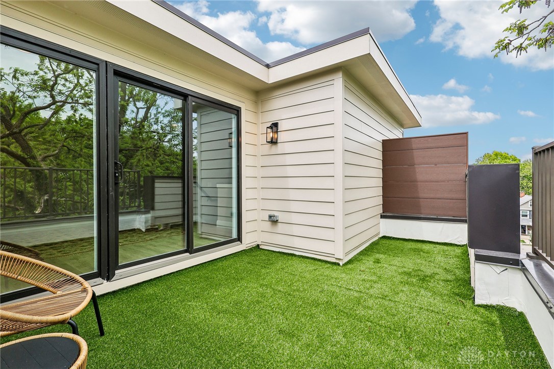3906 Edwards Road, Unit C Cincinnati, OH 45209 - Photo 39 of 46 Enjoy outdoor living on this elevated patio, featuring sliding glass doors and contemporary siding.
