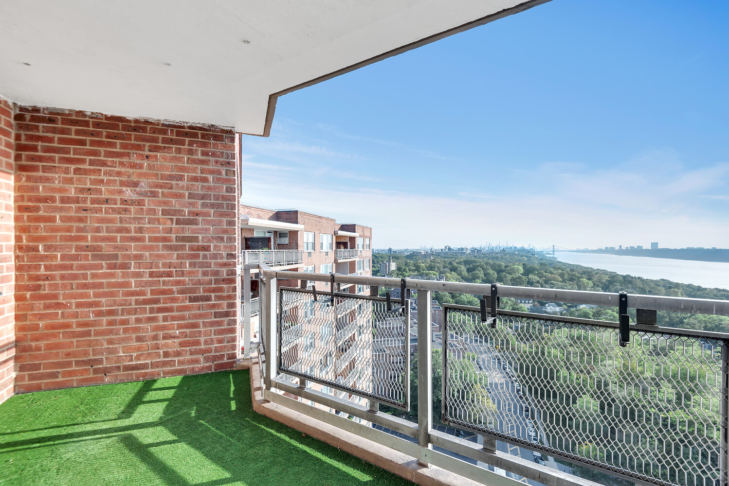 5700 Arlington Avenue, Unit 22R Bronx, NY 10471 - Photo 3 of 14 a view of a balcony with an ocean view
