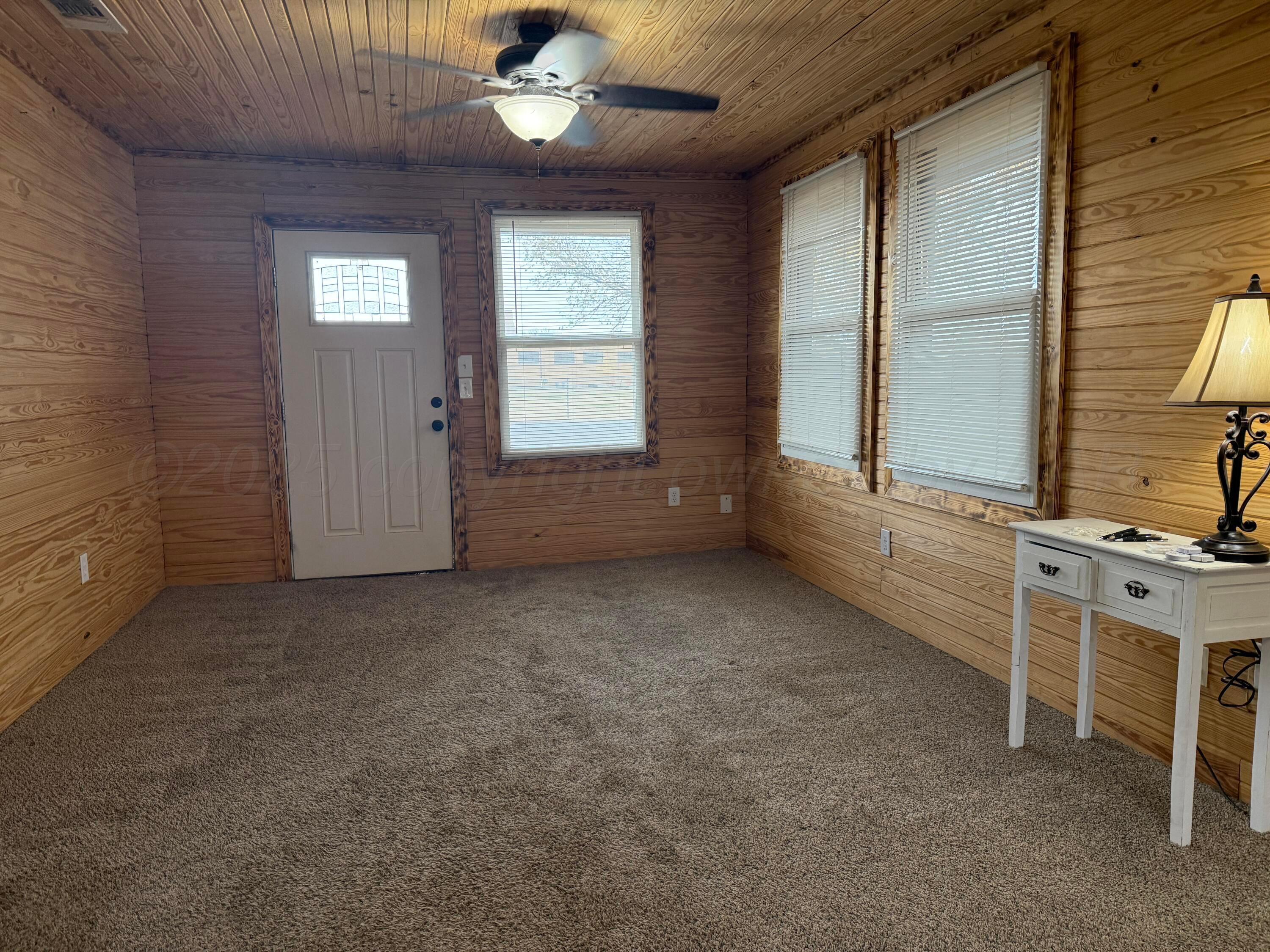 an empty room with windows
