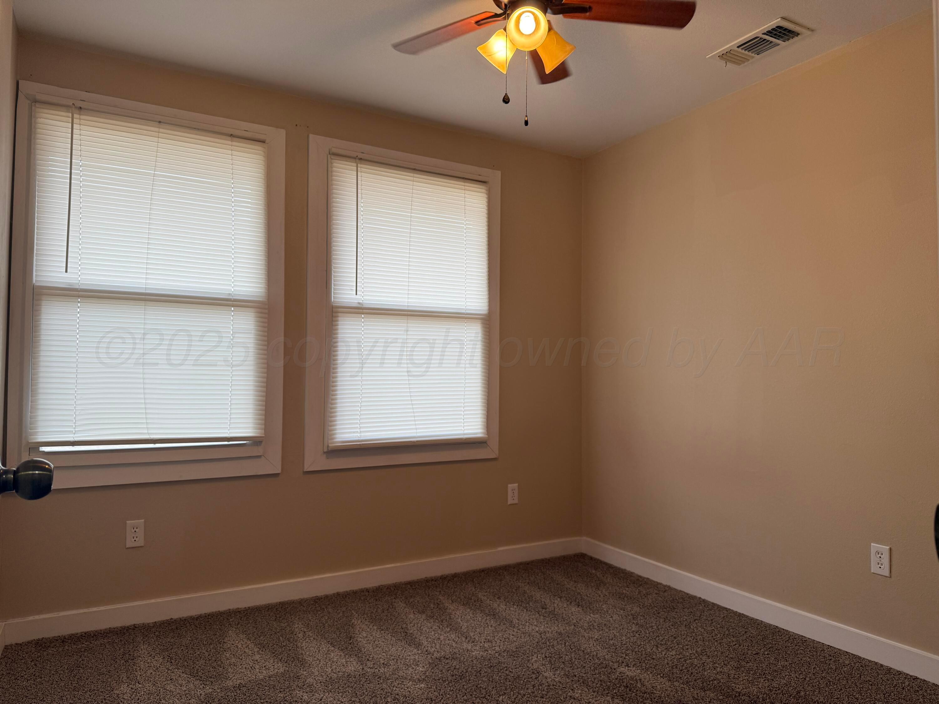701 East 3rd Street Dumas, TX 79029 - Photo 13 of 14 an empty room with a window