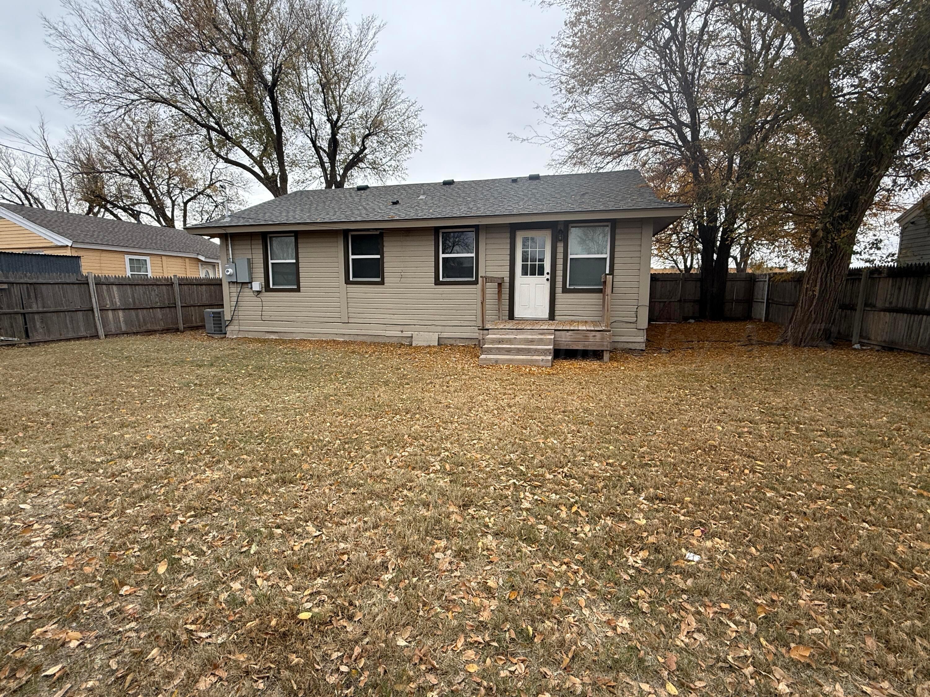 701 East 3rd Street Dumas, TX 79029 - Photo 14 of 14 a view of a house with a yard