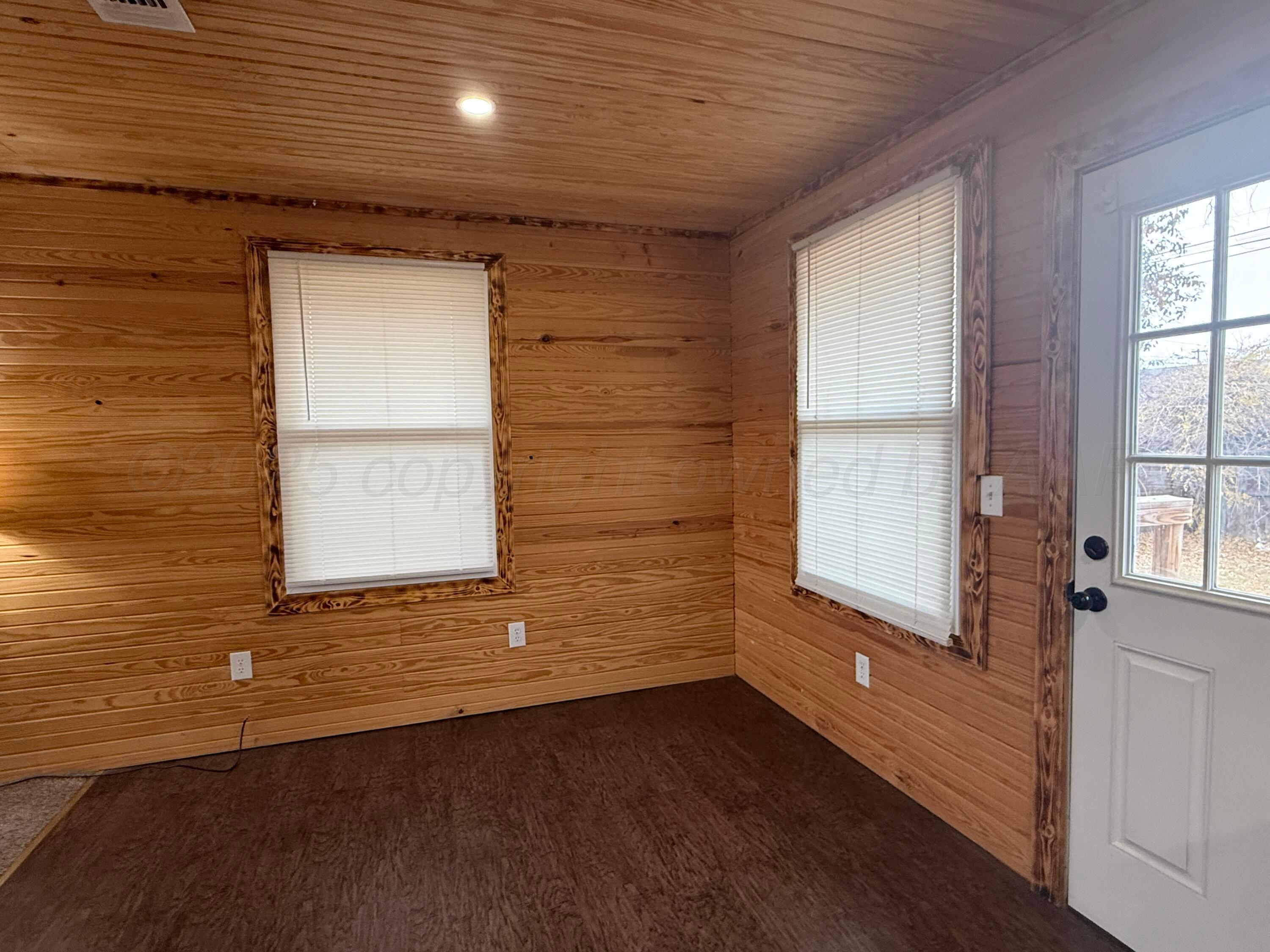 701 East 3rd Street Dumas, TX 79029 - Photo 2 of 14 a view of an empty room and window