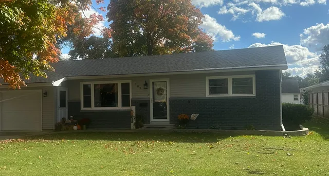 a backyard of a house with yard kitchen and outdoor seating