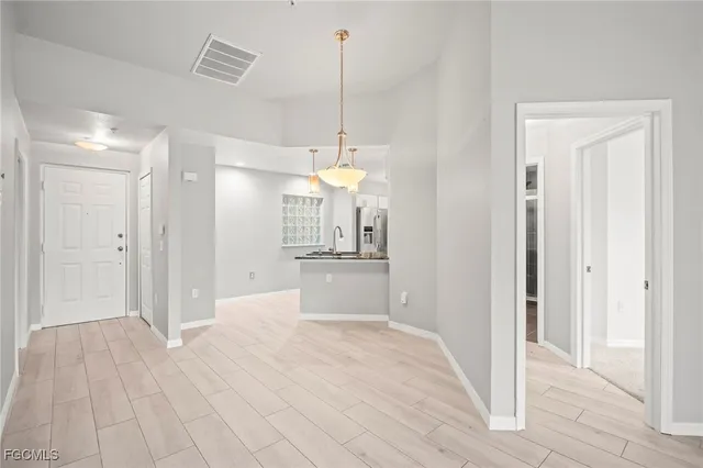 a view of a kitchen cabinets and wooden floor