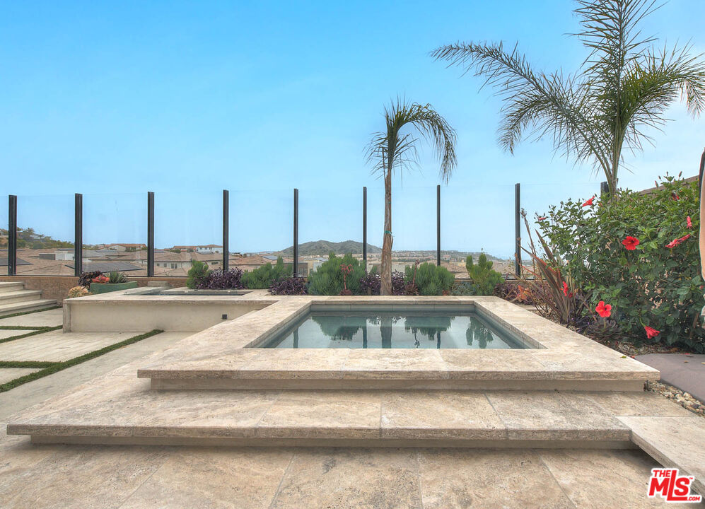 20558 Overlook Court Porter Ranch, CA 91326 - Photo 37 of 48 a view of a swimming pool with a table and chairs