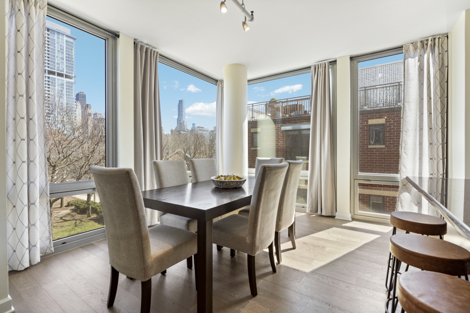 437 West Division Street, Unit 310 Chicago, IL 60610 - Photo 12 of 23 a view of a dining room with furniture and wooden floor