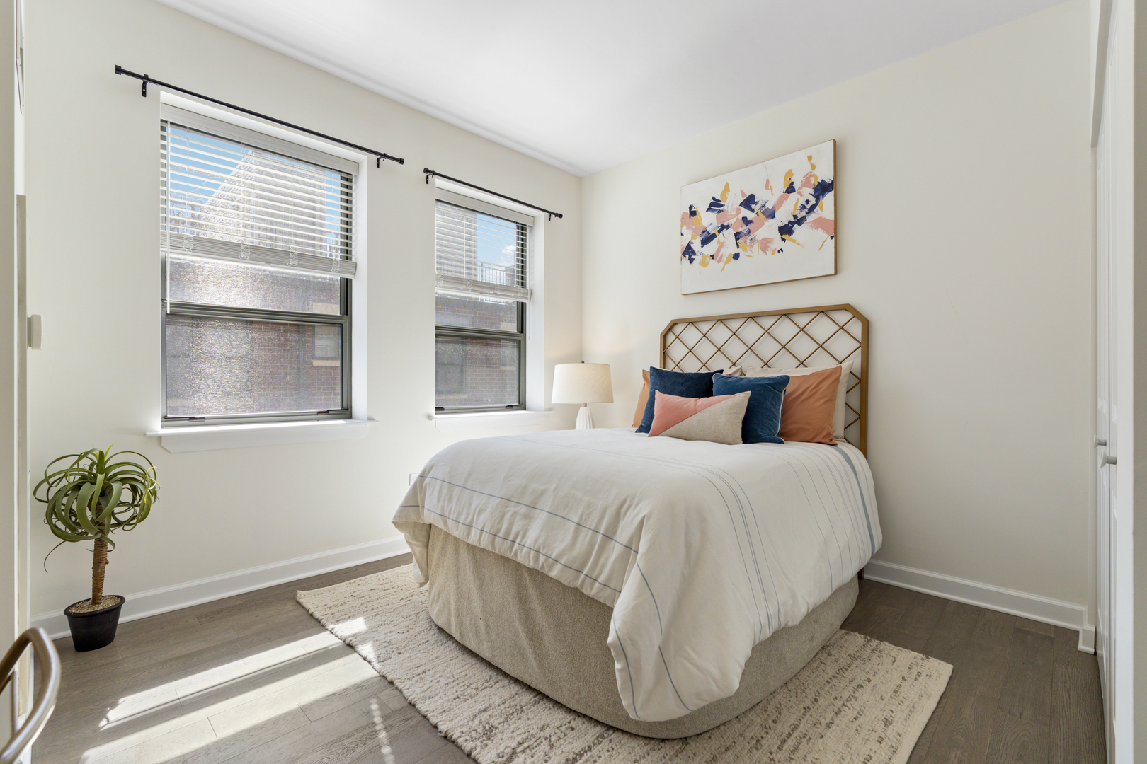 437 West Division Street, Unit 310 Chicago, IL 60610 - Photo 17 of 23 a bed sitting in a bedroom next to a window