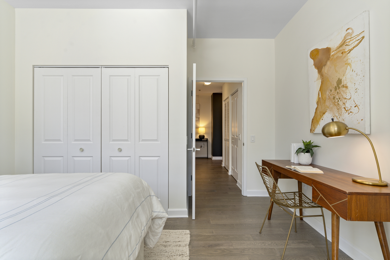 437 West Division Street, Unit 310 Chicago, IL 60610 - Photo 18 of 23 a bedroom with a bed and a table