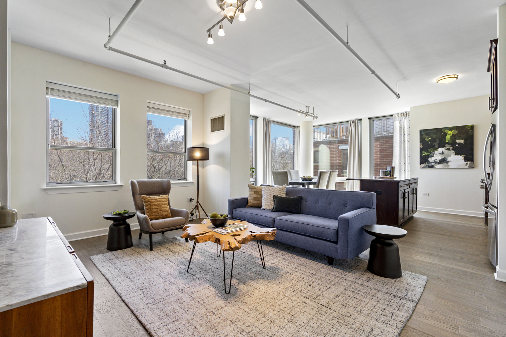 437 West Division Street, Unit 310 Chicago, IL 60610 - Photo 4 of 23 a living room with furniture and a large window