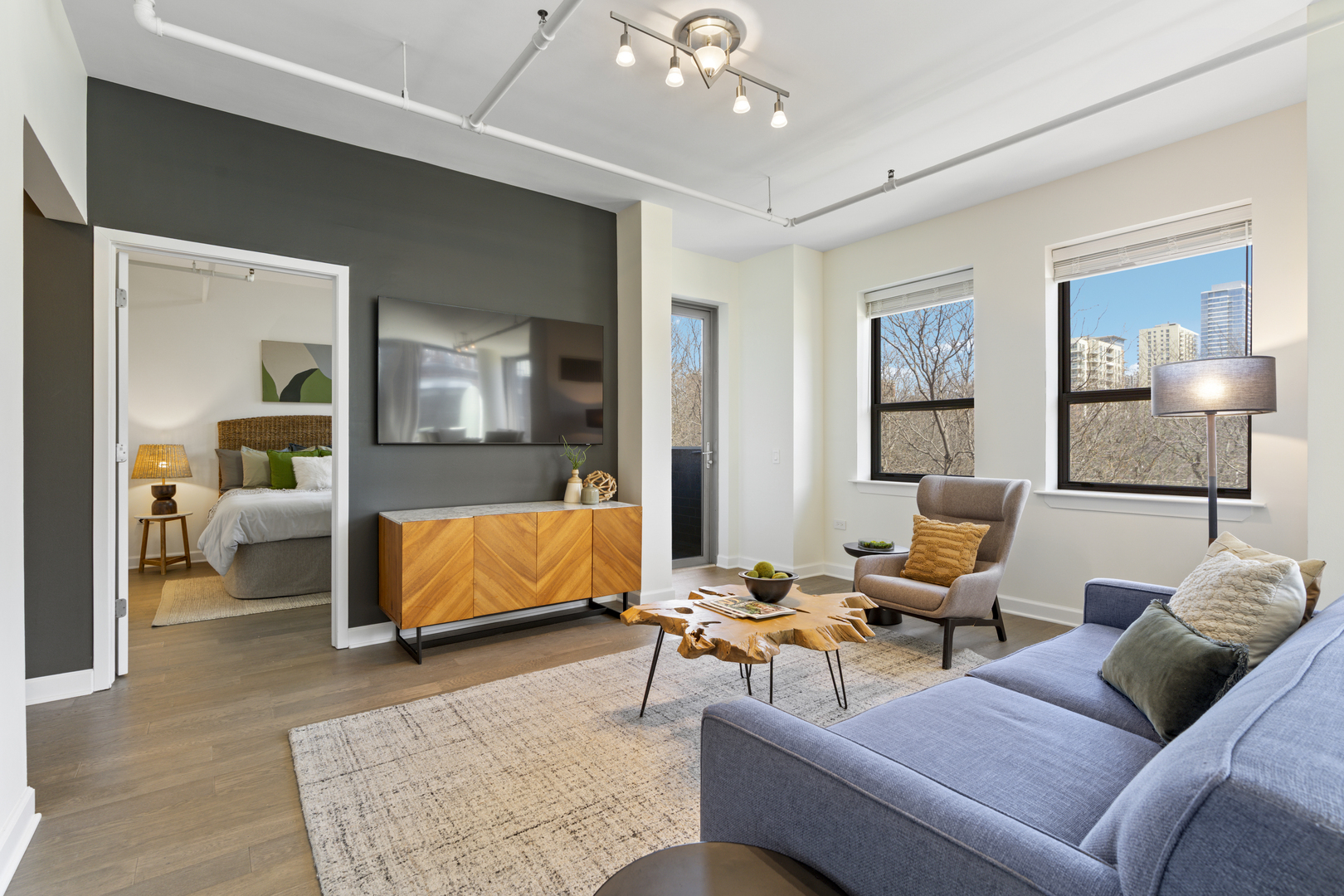 437 West Division Street, Unit 310 Chicago, IL 60610 - Photo 5 of 23 a living room with furniture and a lamp