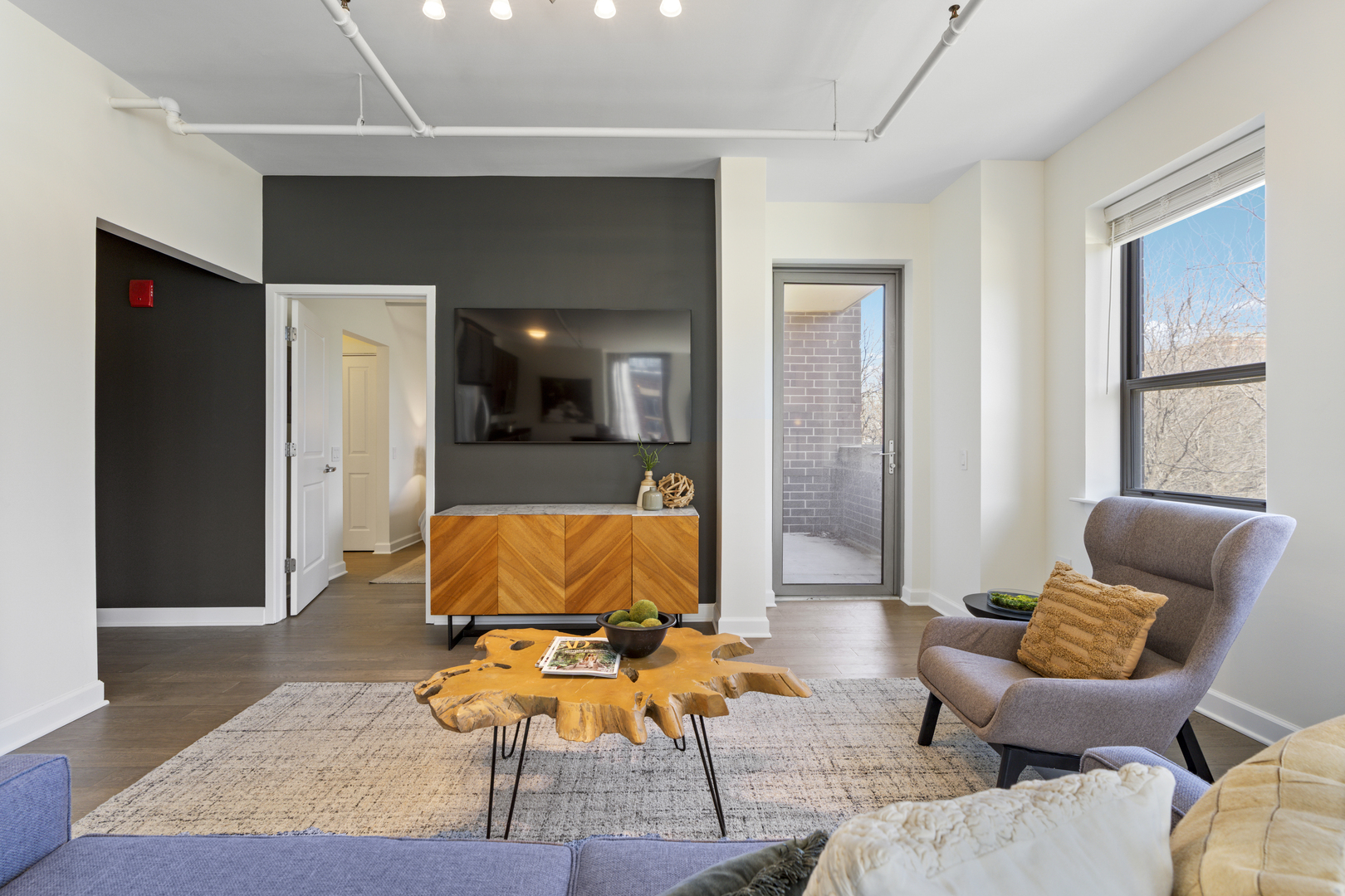 437 West Division Street, Unit 310 Chicago, IL 60610 - Photo 6 of 23 a living room with furniture and a window