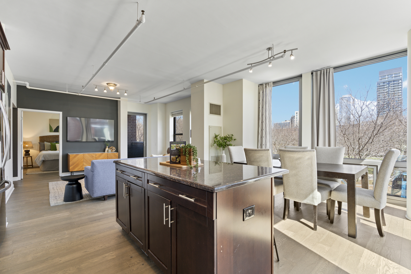 437 West Division Street, Unit 310 Chicago, IL 60610 - Photo 10 of 23 a room with stainless steel appliances kitchen island granite countertop a stove and a view of living room